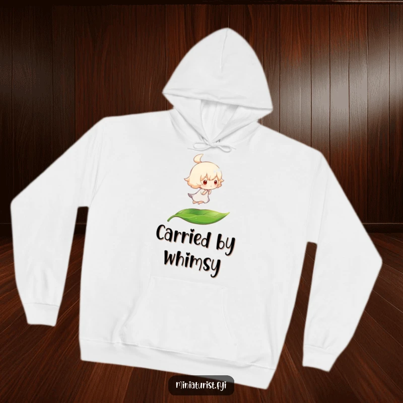 Funny hoodie depicting a tiny character on a leaf, floating peacefully on a gentle breeze, perfect for cozy, humorous downtime.