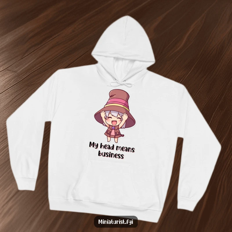 Funny hoodie featuring a small character attempting to wear an enormous hat, radiating excitement and a sense of grand occasion.