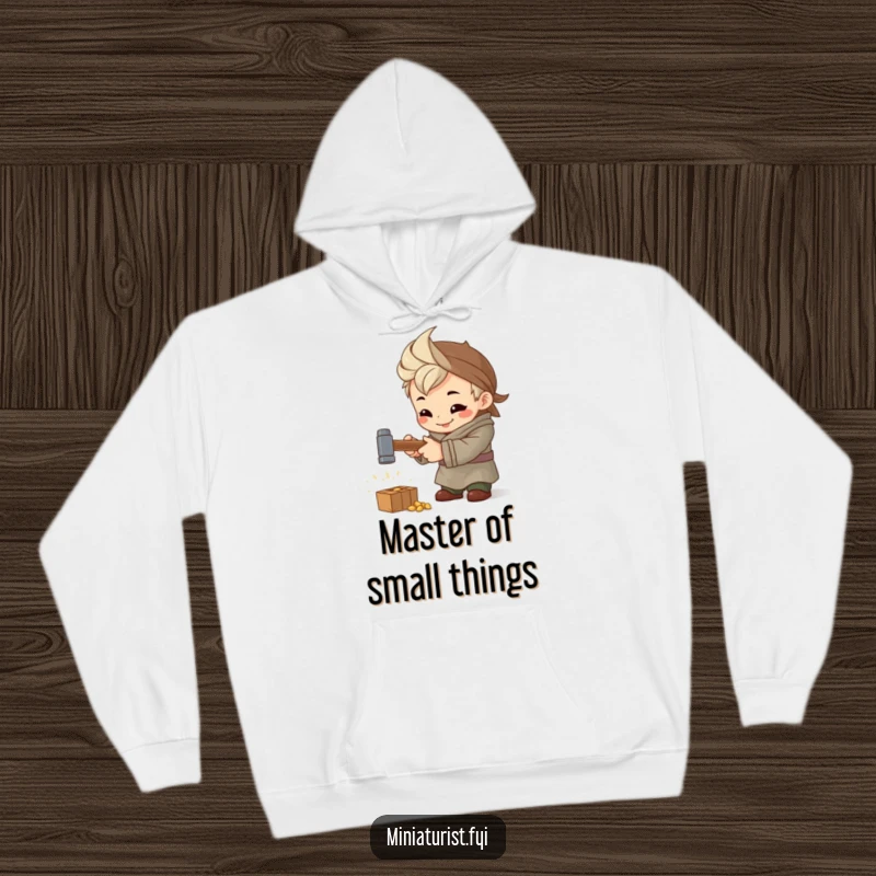 Funny Artisan Hammer Hoodie, cozy sweatshirt with a tiny artisan hammering a miniature hammer intently, perfect for crafters.