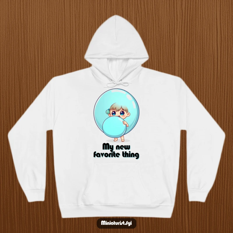 Funny hoodie featuring a small person surprised and delighted holding a huge shiny button, cozy and humorous.