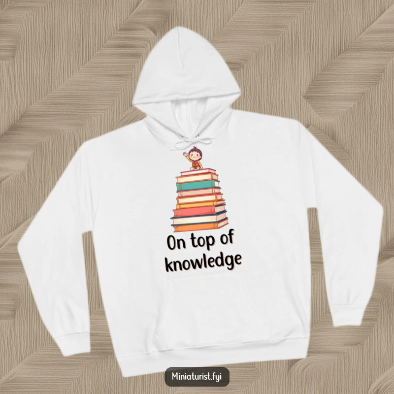 Funny hoodie featuring a tiny figure waving enthusiastically from atop oversized books, cozy and literary.