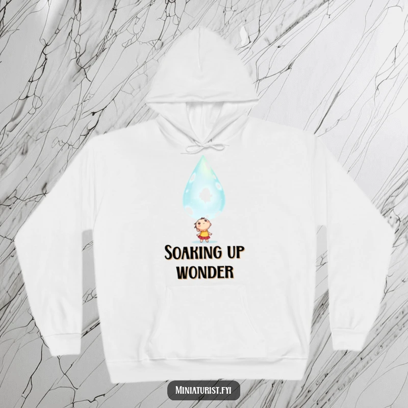 Funny tiny character looking up in awe at a colossal, sparkling dewdrop, depicted on a warm and comfortable hoodie.